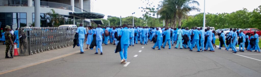 A cross section of HSAs walking into a graduation room from a solidarity walk marking the commemoration of the International Community Health Day.